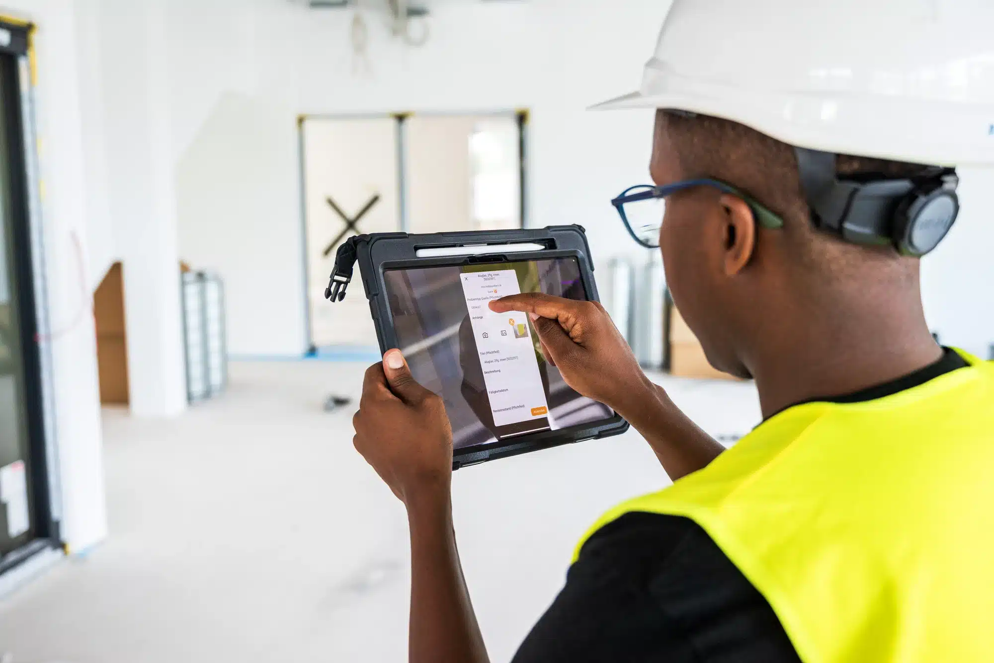 Superintendent logging an issue in the GAMMA AR app during an interior inspection